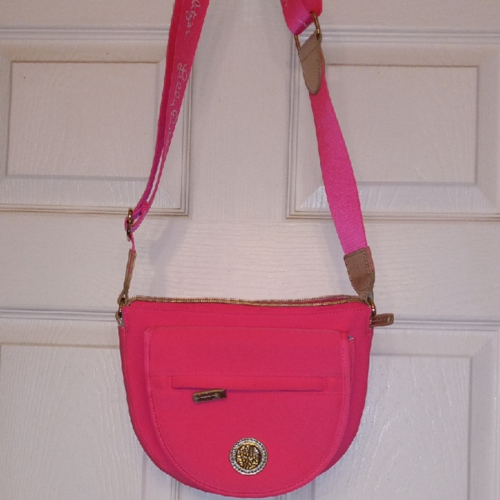 Vibrant Pink Crossbody Bag with Flap Closure and Long Strap .